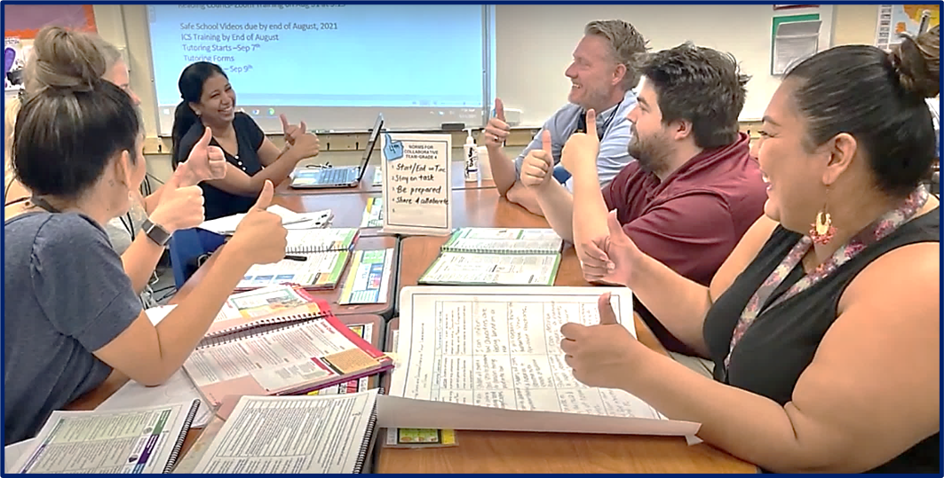 Photo of teachers working together at a conference